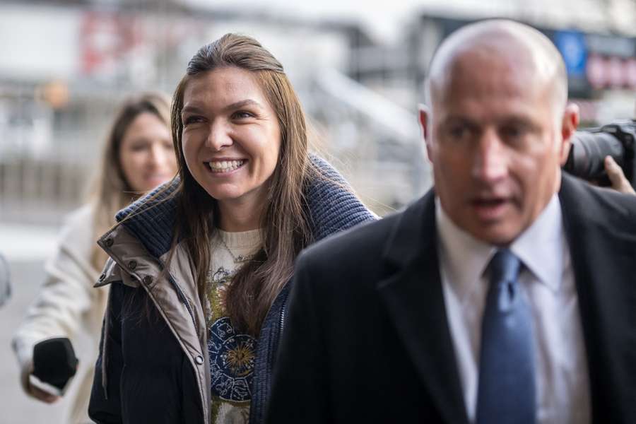 Simona Halep (C) and her lawyer Howard Jacobs (R) arrive at the Court of Arbitration for Sport in Lausanne