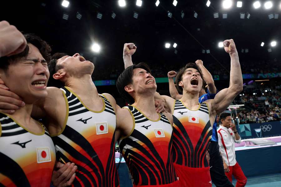 Kazuma Kaya, Shinnosuke Oka, Takaaki Sugino and Wataru Tanigawa of Japan celebrate