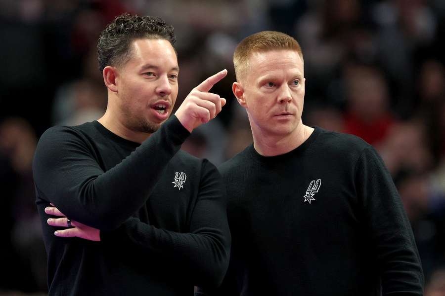 Spurs head coach Mitch Johnson and associate head coach Sean Sweeney (right)