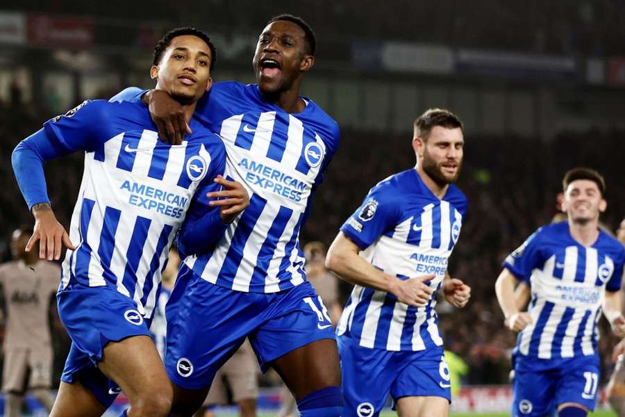 Joao Pedro celebrates with teammates after doubling Brighton's lead over Tottenham