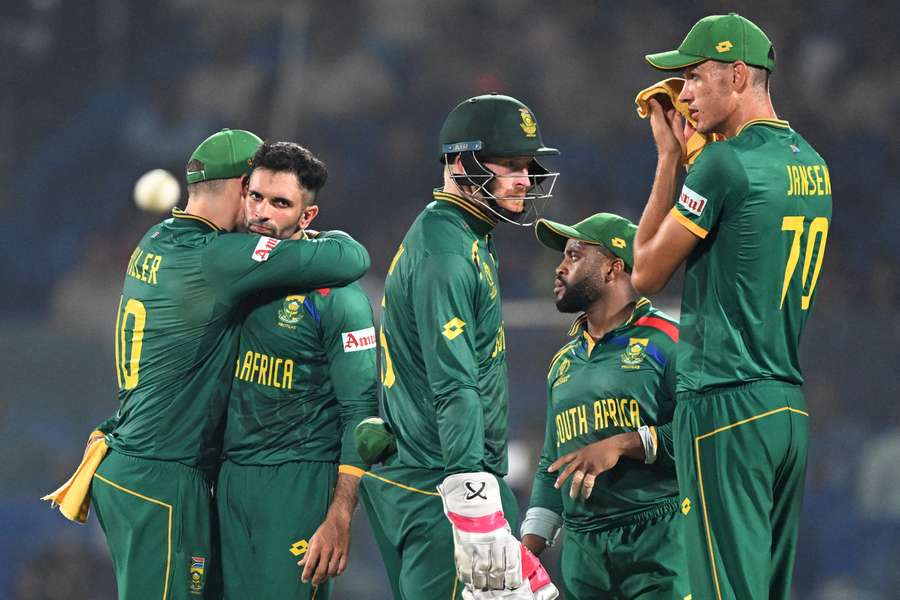 South Africa's Keshav Maharaj (2L) celebrates with teammates after taking the wicket of Sri Lanka's captain Dasun Shanaka