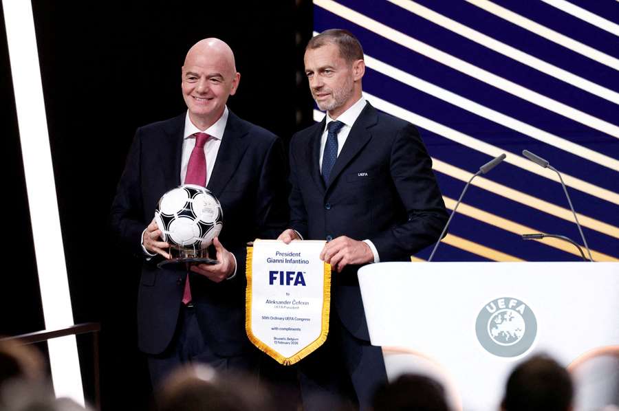 UEFA president Aleksander Ceferin and FIFA president Gianni Infantino pose for a photograph