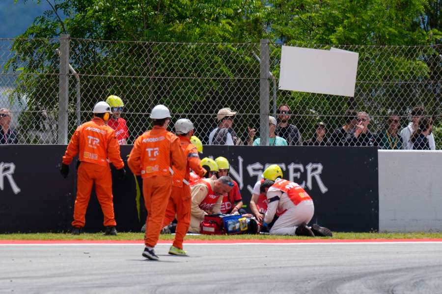 Alex Marquez being helped by paramedics Alex Marquez being helped by paramedics