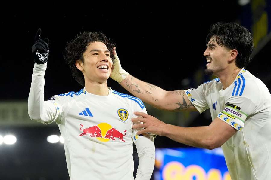 Tanaka celebrates after scoring 