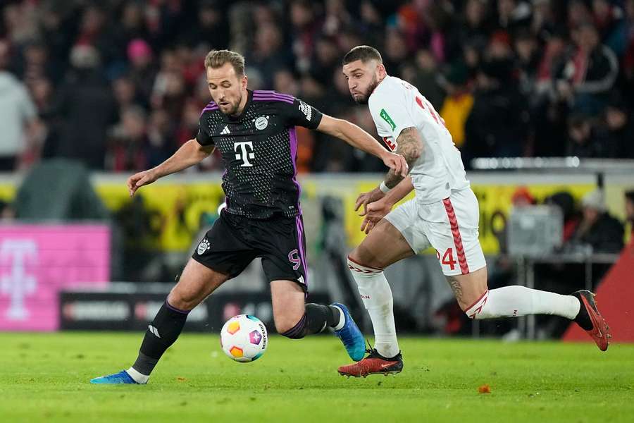 Harry Kane in action with Koln's Julian Chabot