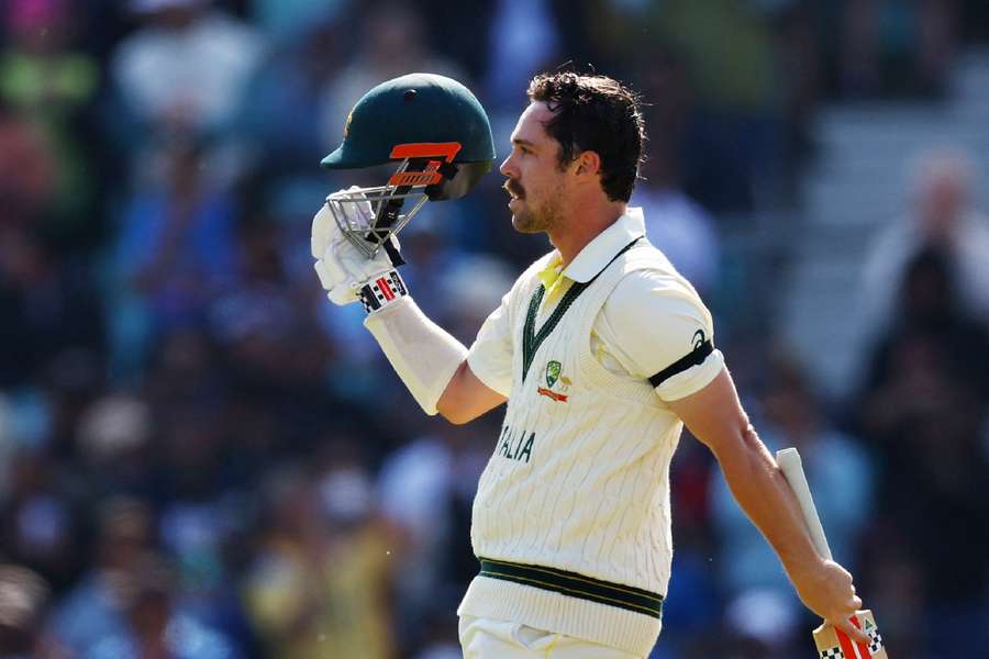 Travis Head celebrates his century