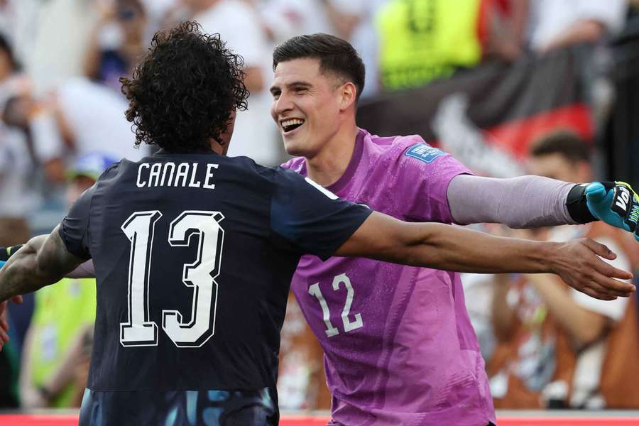 Paraguay's Orlando Gill and and Jose Canale celebrate after beating Germany on penalties to reach the last 16