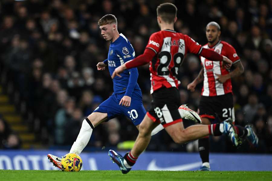 Cole Palmer runs to score the opening goal against Sheffield United