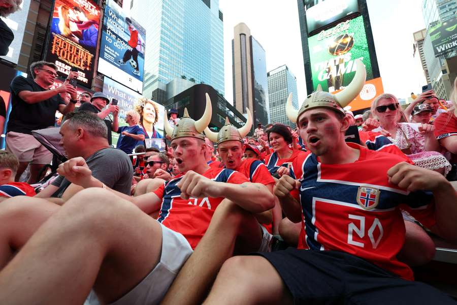 Fans perform the 'Viking row' in Times Square