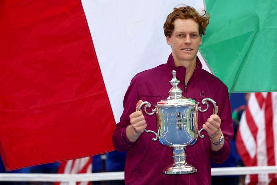 Jannik Sinner of Italy celebrates with the winners trophy