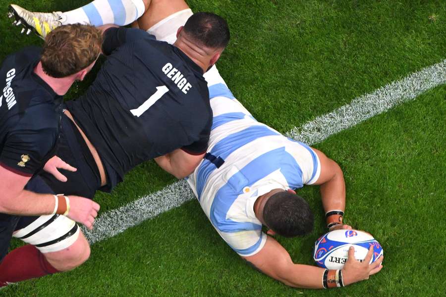 Argentina's loosehead prop Thomas Gallo pins the ball on the ground for a try which was disallowed