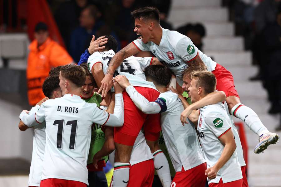 Twente's players celebrate their goal