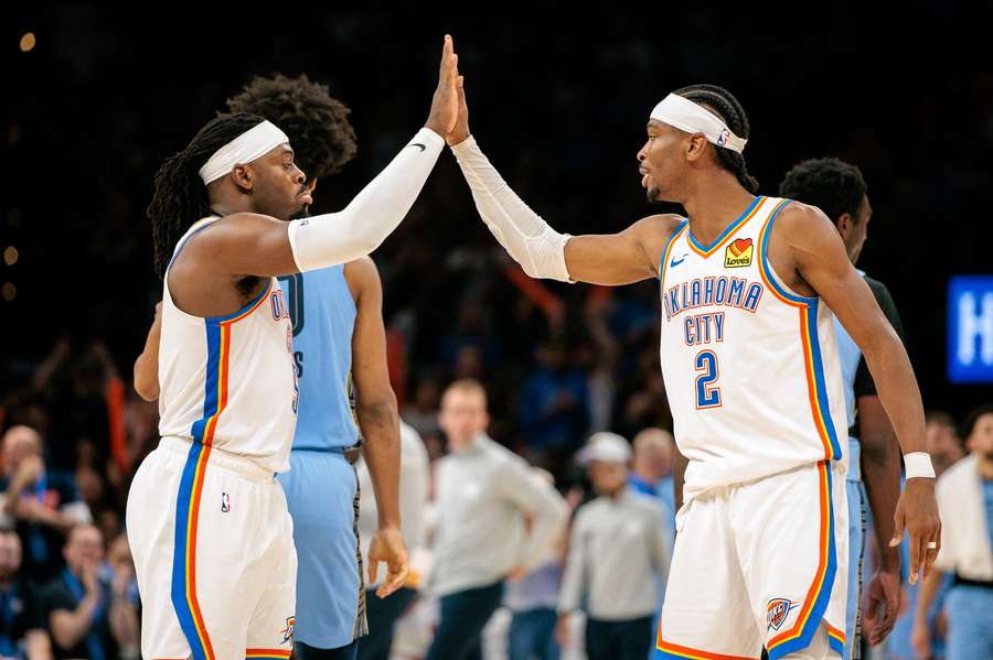 Luguentz Dort and Shai Gilgeous-Alexander of the Oklahoma City Thunder during the fourth quarter against the Memphis Grizzlies