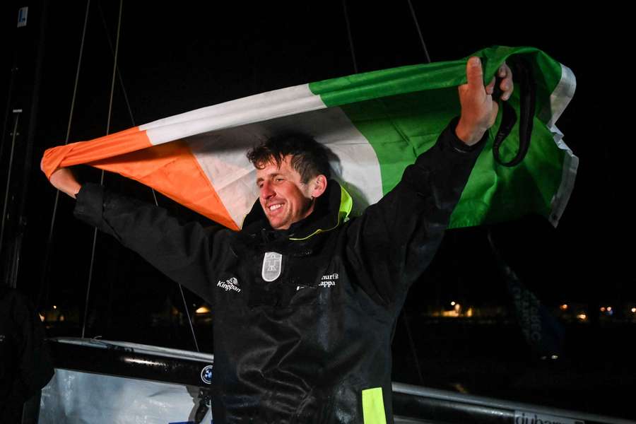 Tom Dolan avec son drapeau lors de sa victoire.