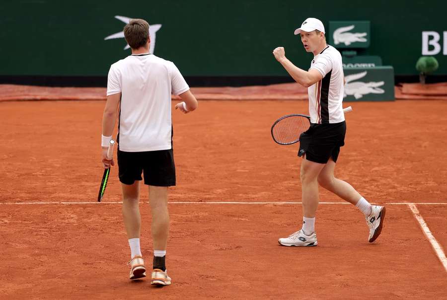 Heliovaara (right) and Patten celebrate a point during their Semi-final win