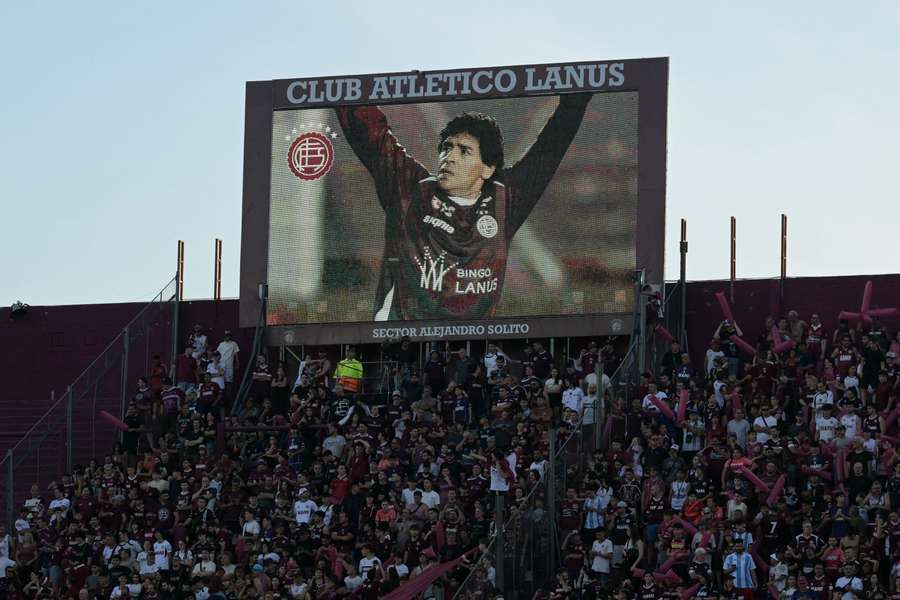 A picture of the late Argentine football star Diego Maradona wearing a Lanus jersey is displayed on a huge screen to celebrate his anniversary