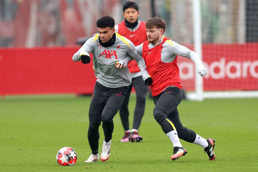 Luis Diaz of Liverpool controls the ball under pressure from teammate Harvey Elliott