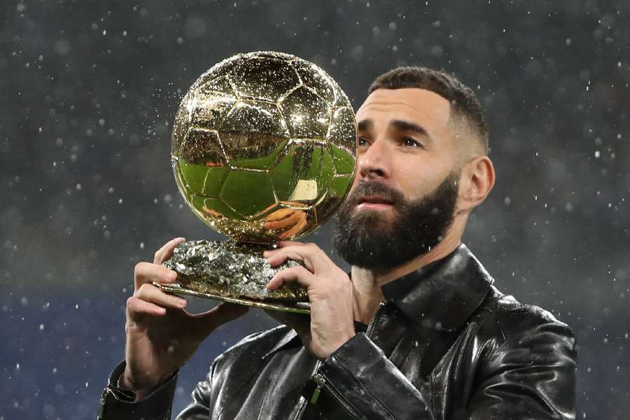 Karim Benzema poses with the Ballon d'Or trophy