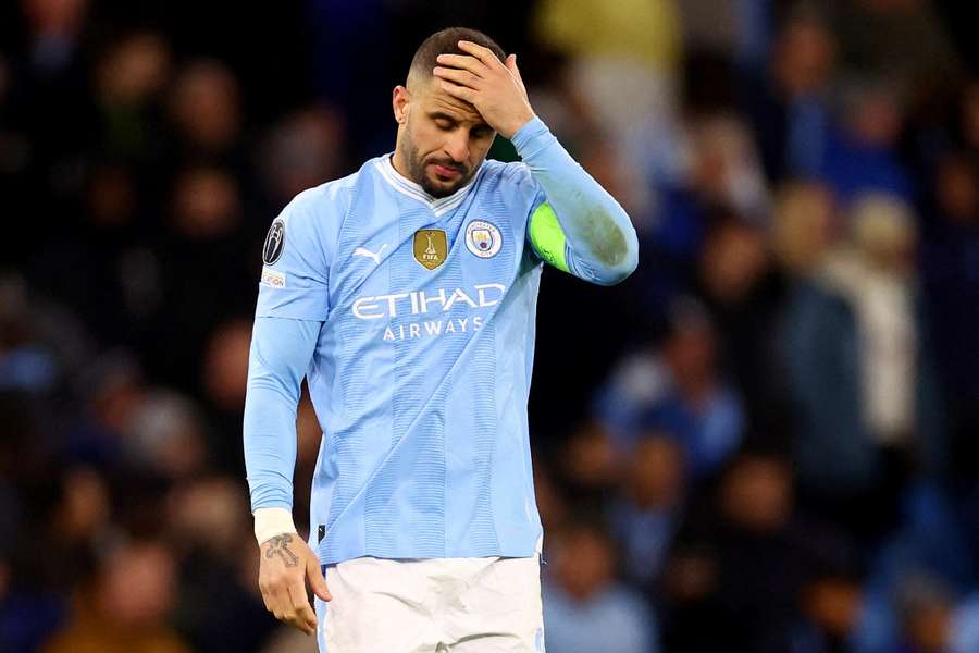 Kyle Walker cuts a dejected figure after being knocked out of the Champions League
