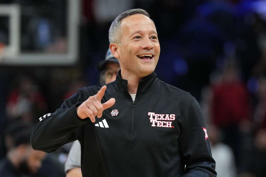 Texas Tech head coach Grant McCasland smiling after defeating Arkansas during the Sweet 16 in the 2025 NCAA Tournament