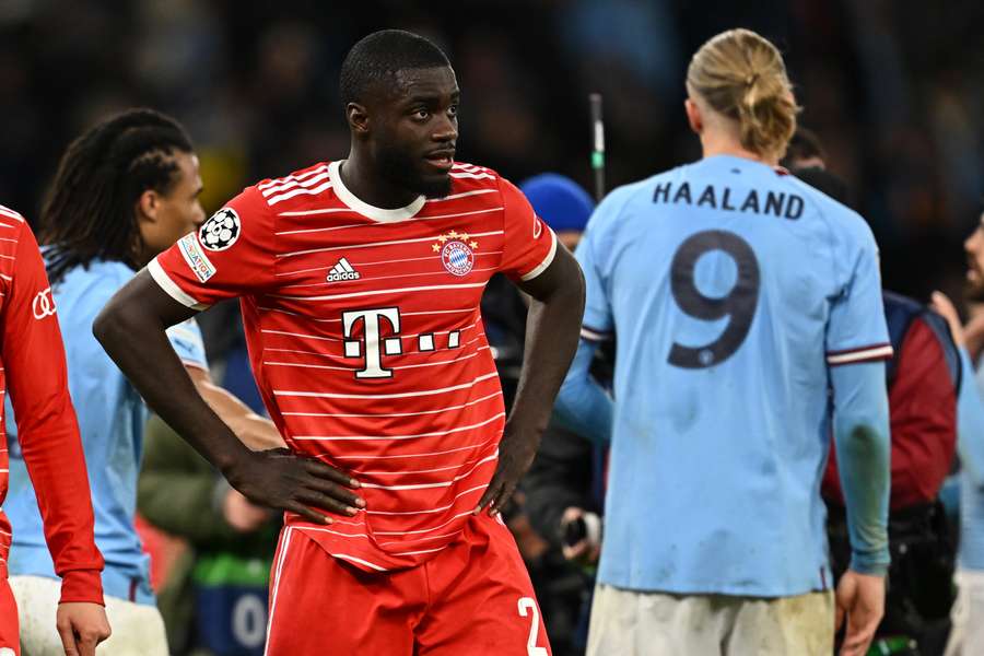 Bayern defender Upamecano looks dejected after his side's defeat away to Man City