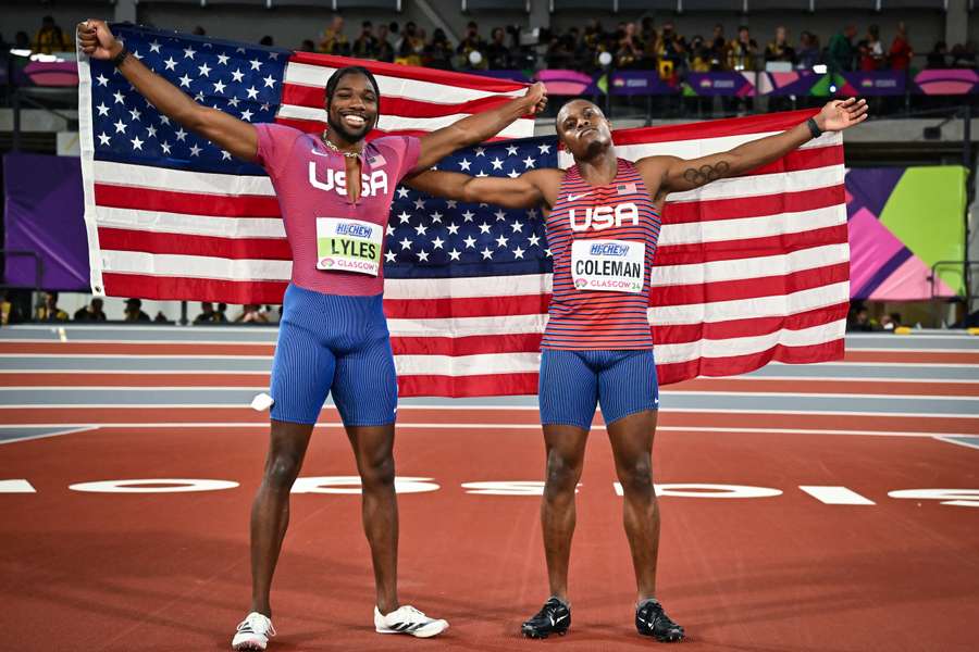 Second-placed Noah Lyles (L) and first-placed Christian Coleman celebrate after winning in the Men's 60m final
