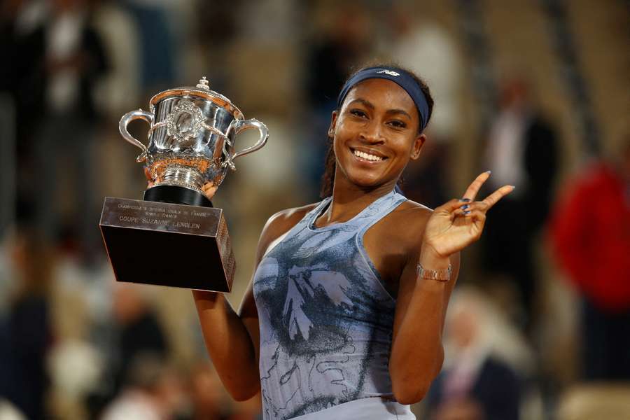 Coco Gauff celebrates with the trophy after winning the women's singles final against Aryna Sabalenka Coco Gauff celebrates with the trophy after winning the women's singles final against Aryna Sabalenka