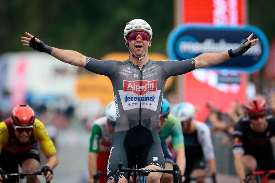 Alpecin's Australian rider Kaden Groves celebrates after victory as he crosses the finish of the sixth stage of the Giro