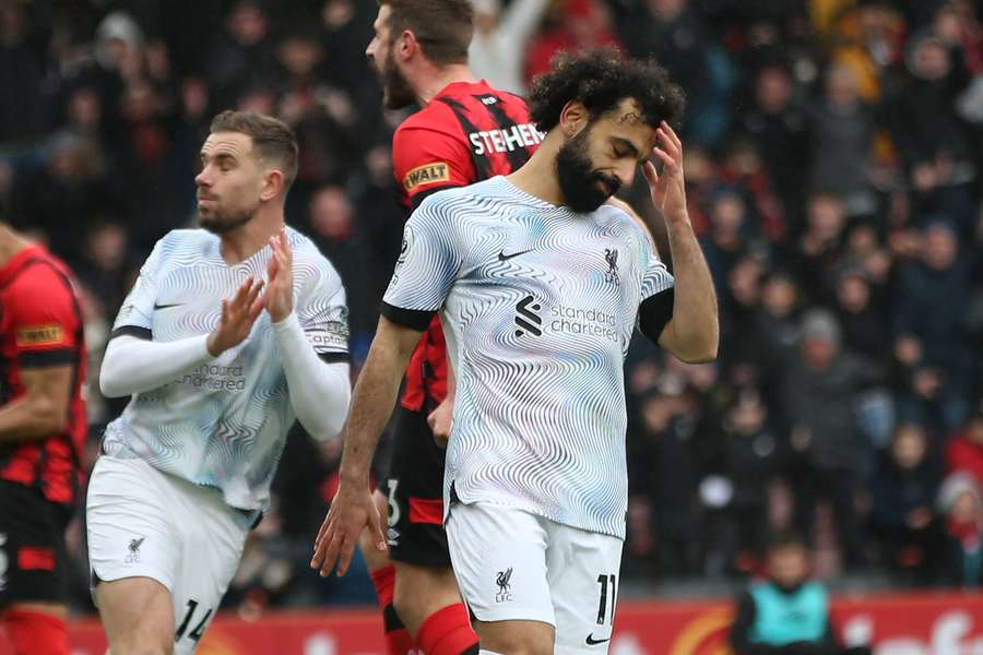 Liverpool's Egyptian striker Mohamed Salah reacts after missing his penalty kick