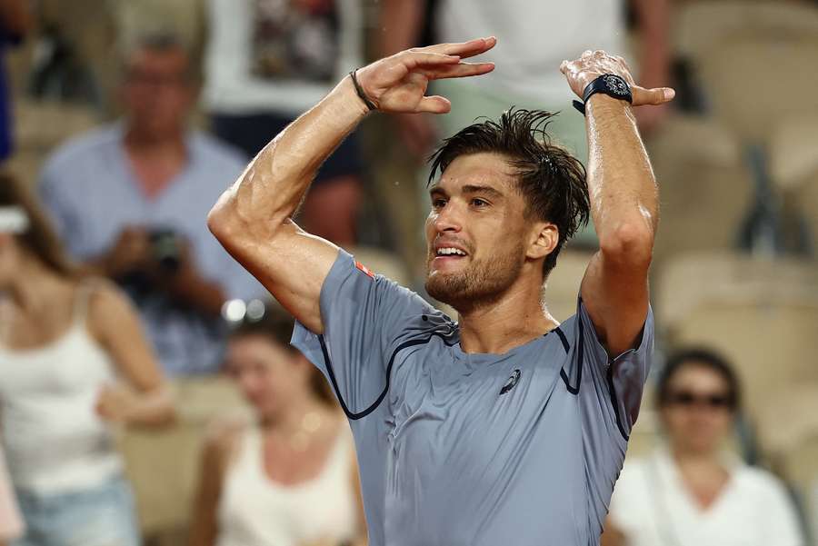 Raphael Collignon celebrates after winning his second round match against Ben Shelton.