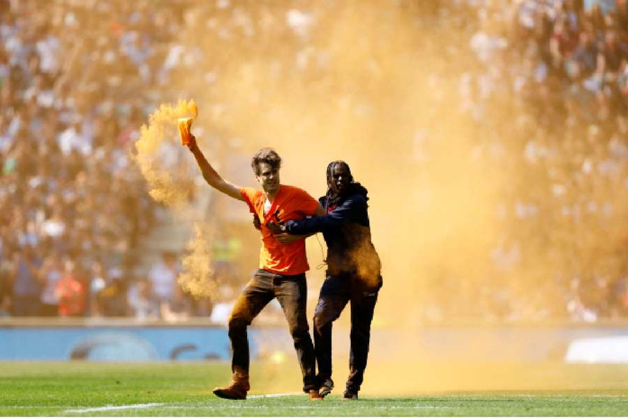 A Just Stop Oil protester invades the pitch