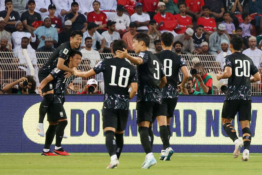 South Korea's Hwang Hee-Chan celebrates scoring their first goal with Son Heung-Min