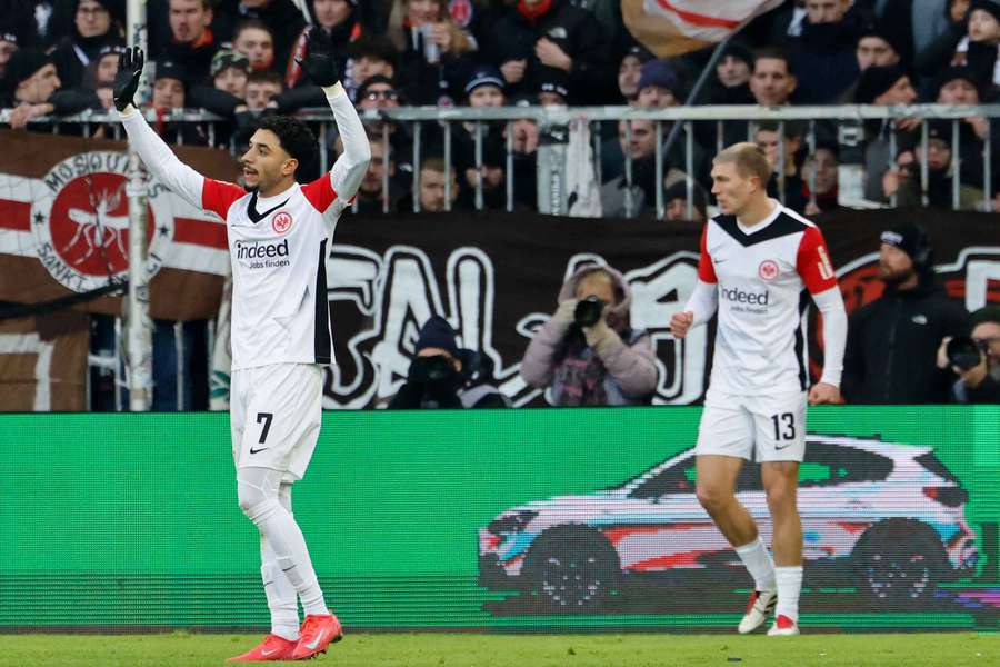 Omar Marmoush (left) celebrates his goal