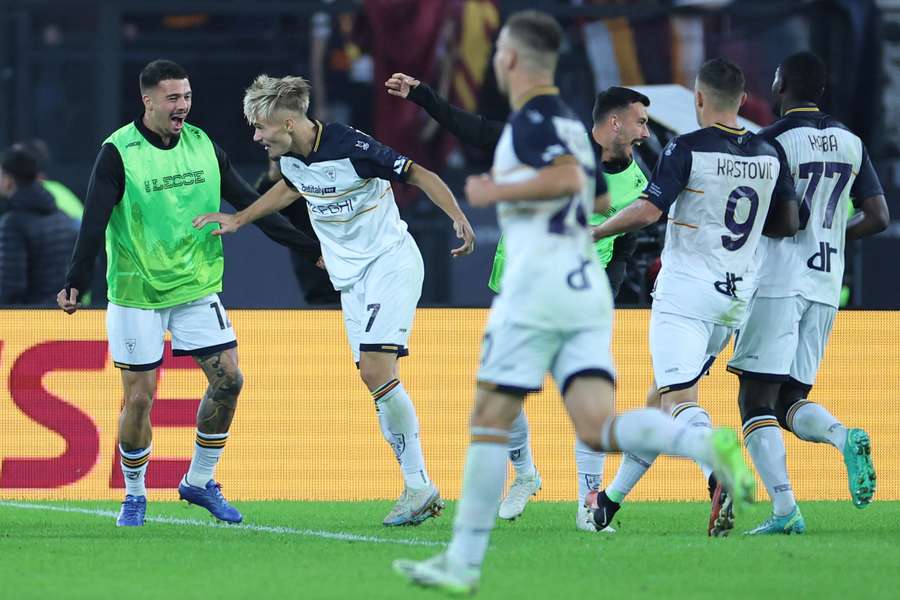 Pontus Almqvist celebrates with teammates after scoring the opening goal for Lecce