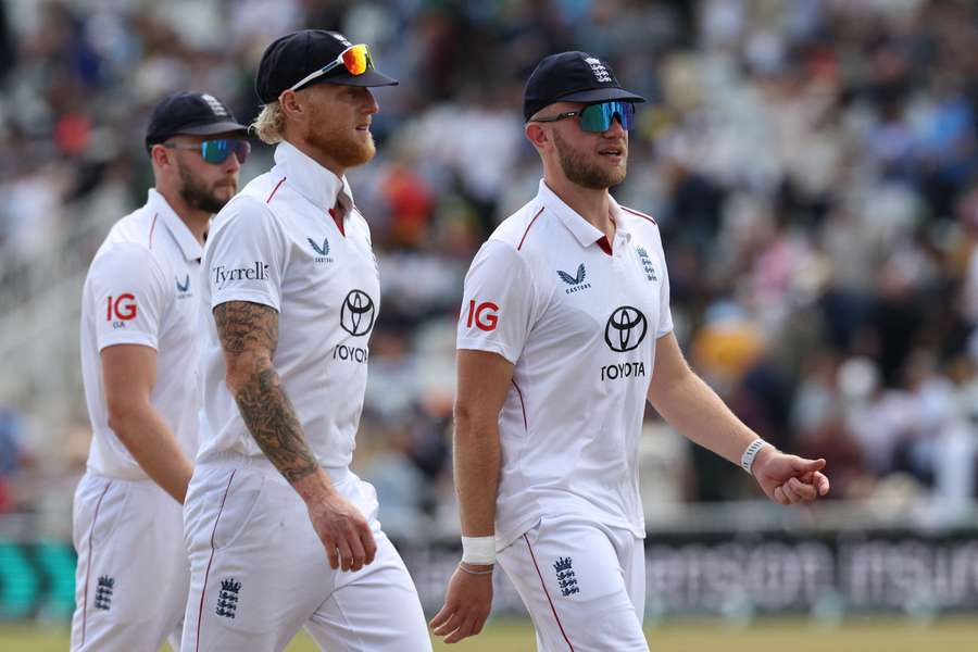 England's Gus Atkinson, captain Ben Stokes and Sam Cook leave the field for lunch 