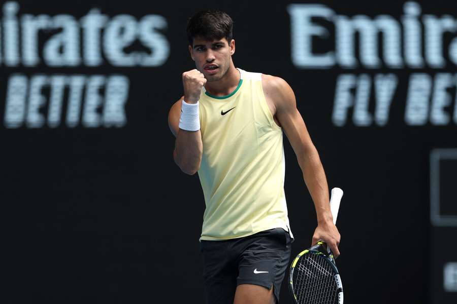 Carlos Alcaraz serves against China's Shang Juncheng at the Australian Open