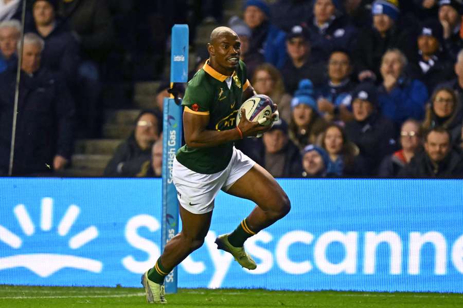 South Africa wing Makazole Mapimpi runs in his second try against Scotland