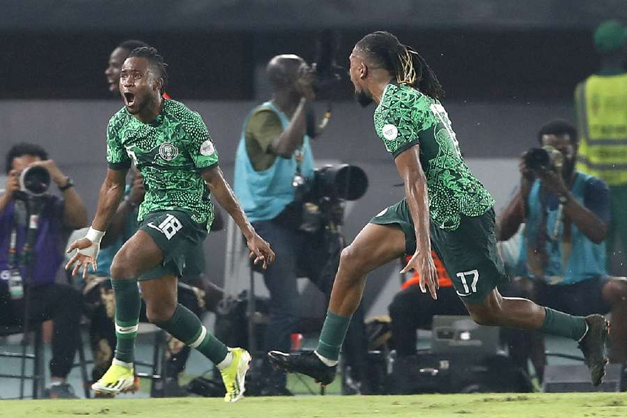 Ademola Lookman (L) of Nigeria celebrates after scoring a goal during the match against Cameroon