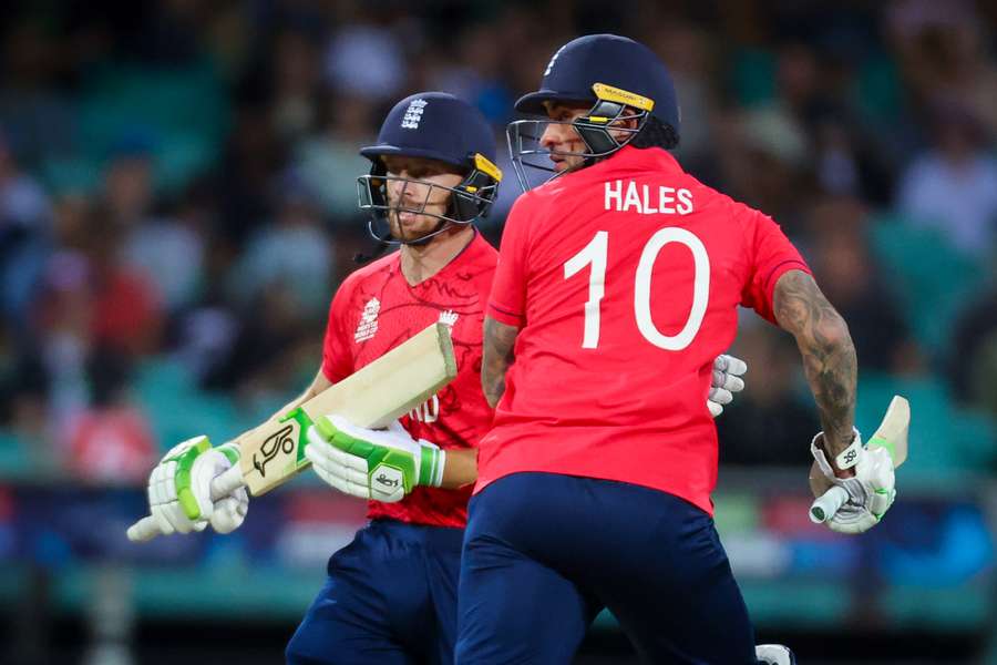 England’s captain Jos Buttler (L) and team mate Alex Hales run between wickets during the ICC men's Twenty20 World Cup 2022 cricket match between England and Sri Lanka 