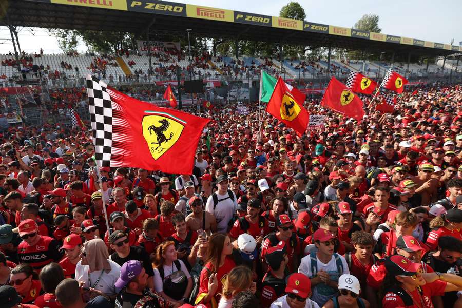 Ferrari's fans descend onto the track after the race