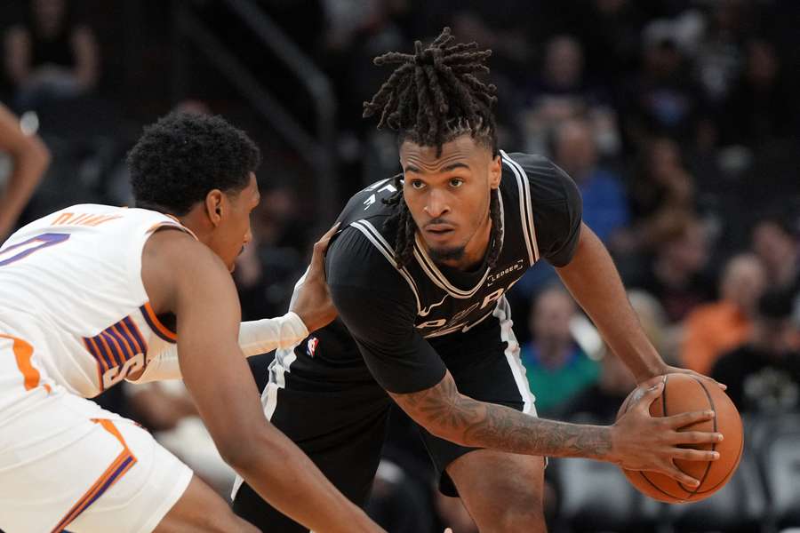 San Antonio Spurs guard Stephon Castle shields the ball from Phoenix Suns forward Ryan Dunn San Antonio Spurs guard Stephon Castle shields the ball from Phoenix Suns forward Ryan Dunn