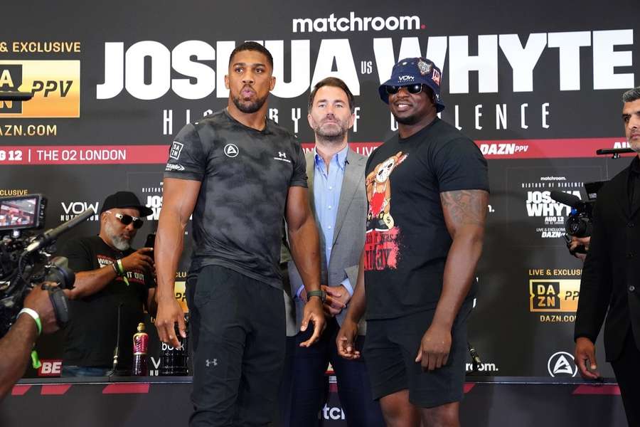 Joshua (L) will have to wait for his rematch with Whyte (R)