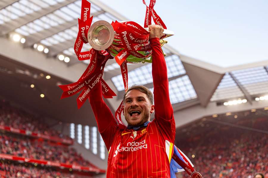 Alexis Mac Allister lifted the Premier League trophy