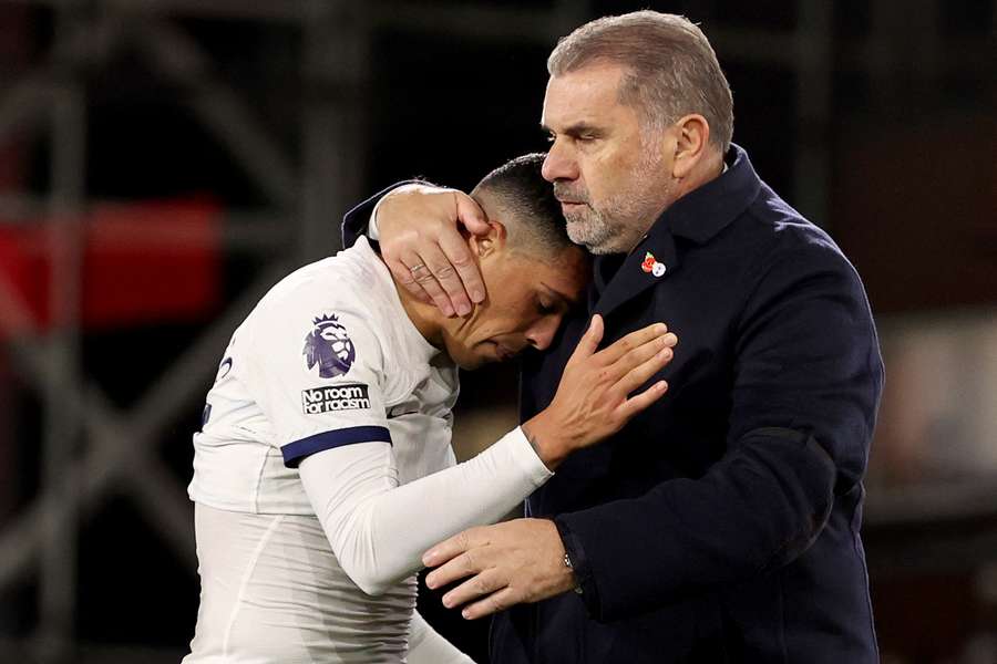Pedro Porro and Ange Postecoglou embrace