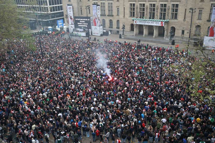 Feyenoord fans stand outside the town hall in Rotterdam ahead of the celebrations