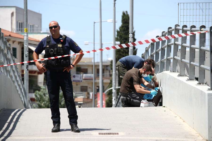 A police officer stands at the scene as investigations are ongoing outside Agia Sophia Stadium