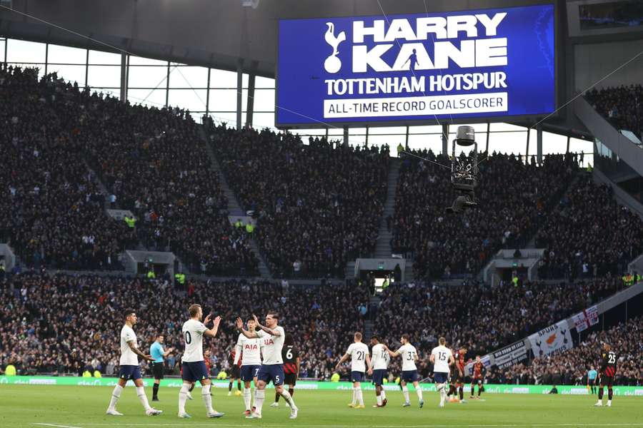 Tottenham's Harry Kane celebrates with teammates after scoring his team first goal against Manchester City