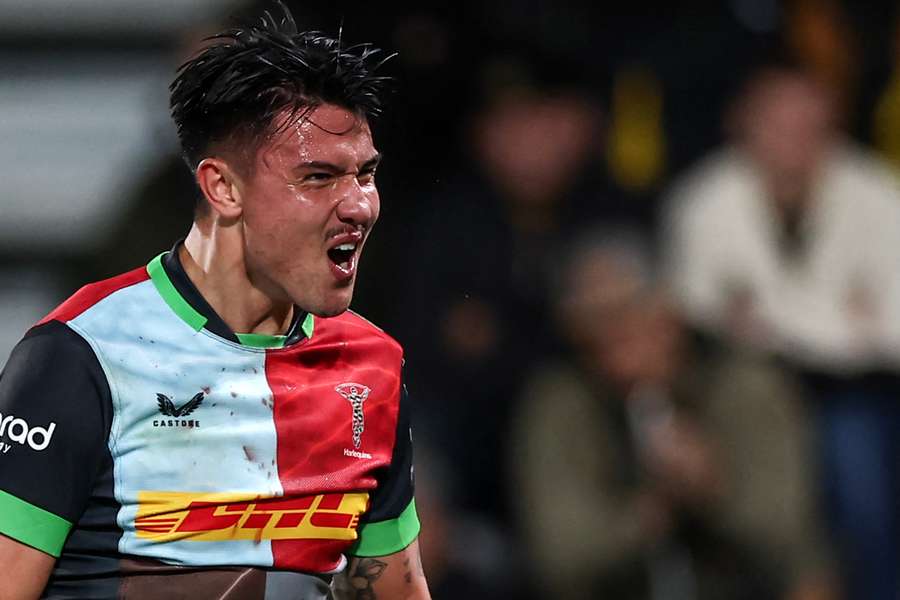 Marcus Smith celebrates after Harlequins' victory