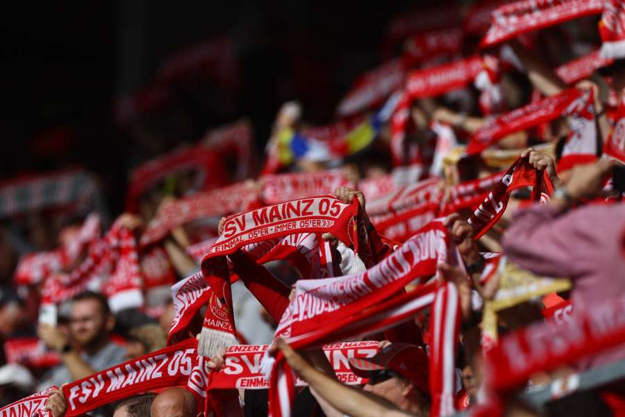 Mainz fans holding flags inside the stadium 
