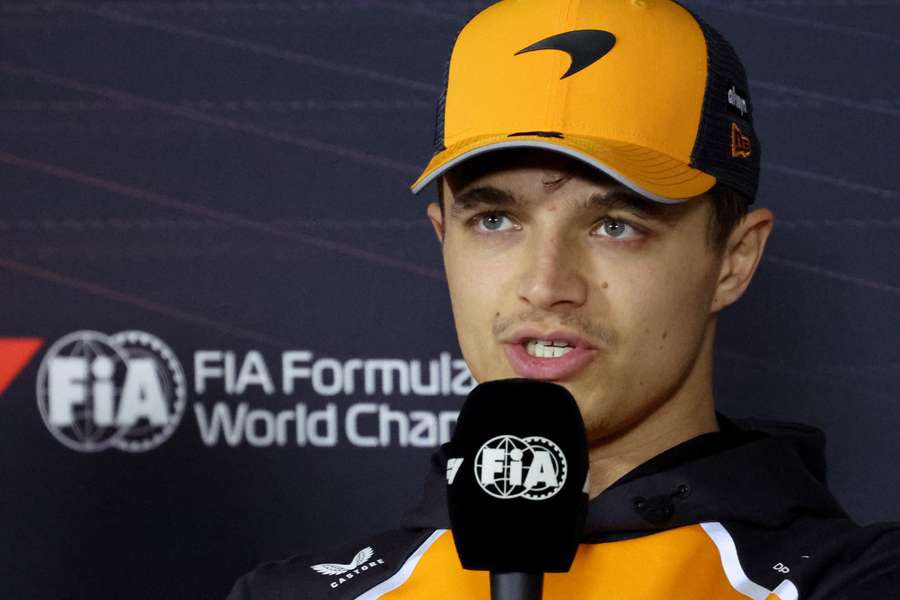 Lando Norris speaks to the press